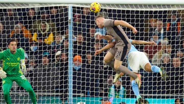 Premier League: Spurs snatch point at Manchester City after Liverpool drama