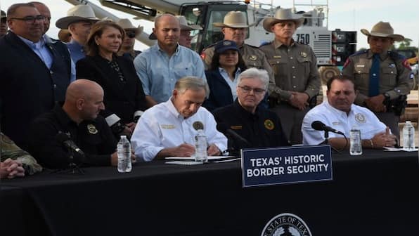 Texas governor signs bill that lets police arrest migrants who enter the US illegally