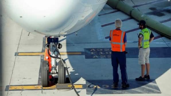 Unidentified stowaway found alive in plane's landing gear compartment at Paris Airport