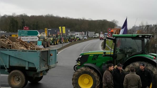French farmers block highways around Paris as protests ratchet up pressure on President Macron
