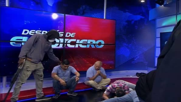 Armed men storm an Ecuador TV studio during a live broadcast as attacks in the country escalate