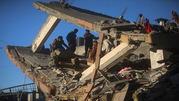 Palestinians flee from central Gaza's main hospital as strike kills Hezbollah commander in Lebanon