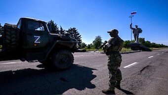 A russian serviceman stands guard next to monument to metallurgists with a Russian flag on the top, at the entrance of Mariupol on 12 June 2022. AFP File (Image used for representational purposes only)