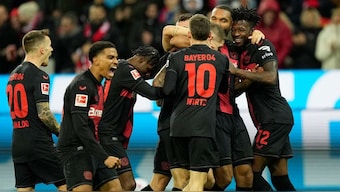 Bayer Leverkusen's team players celebrate after Robert Andrich scored his side's winning goal vs Mainz. AP