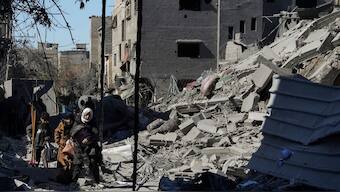Palestinians inspect the rubble of destroyed buildings after an Israeli airstrike in Nusseirat refugee camp, central Gaza Strip, on Thursday, Feb. 29, 2024.-AP