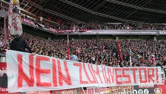 Bayern Munich supporters protest with a banner reading "No to investors!" during the Bundesliga match against Bayer Leverkusen. AP