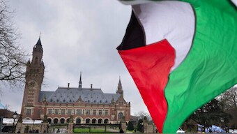 A Palestinian flag flies outside the United Nations' highest court during historic hearings in The Hague, Netherlands, on 21 February, 2024, into the legality of Israel's 57-year rule of West Bank and east Jerusalem. AP File
