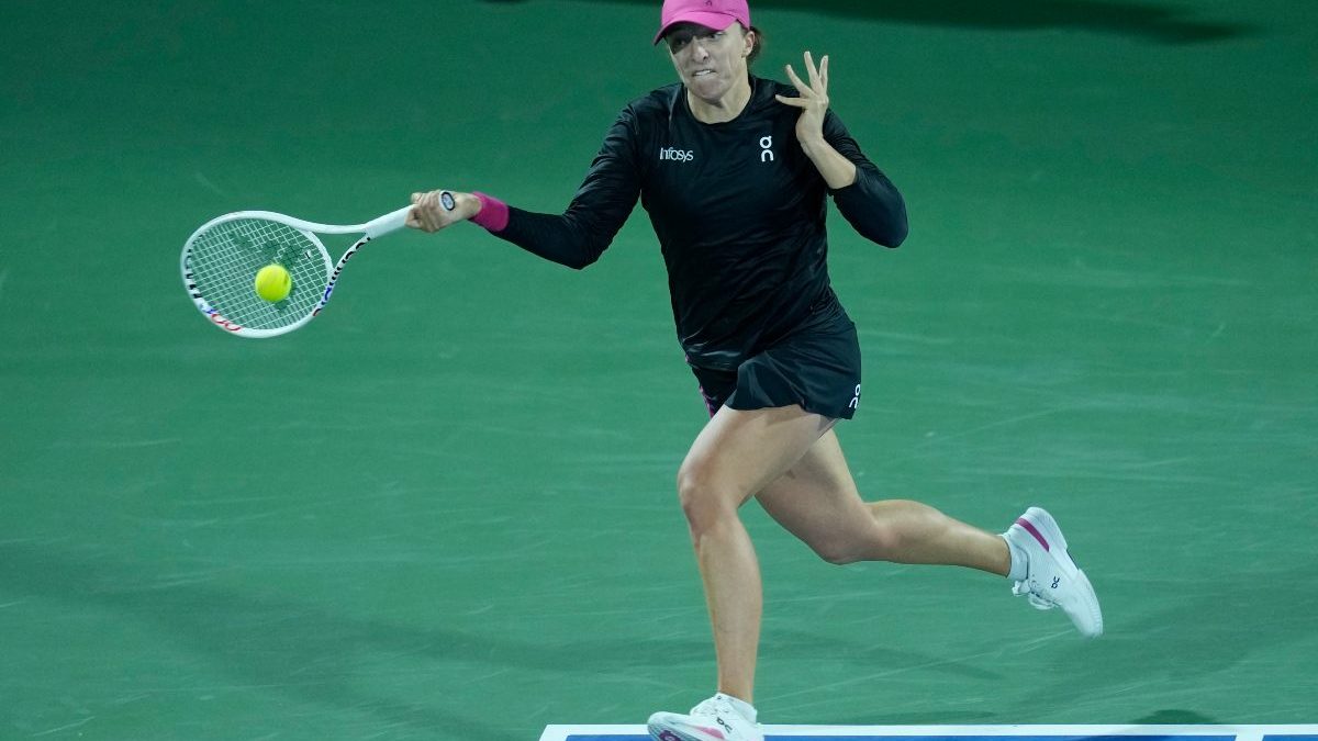 Iga Swiatek returns the ball to Qinwen Zheng during a quarter final match of the Dubai Duty Free Tennis Championships. AP Iga Swiatek returns the ball to Qinwen Zheng during a quarter final match of the Dubai Duty Free Tennis Championships. AP