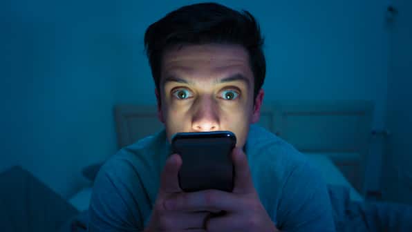 Over 50% smartphone users pick them up without thought, average user spends 31% of waking time on phones