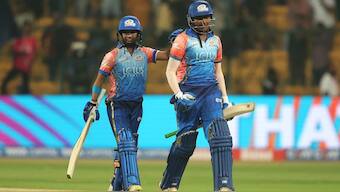 Sajeevan Sajana celebrates after hitting a six off last ball to help Mumbai Indians win. BCCI image