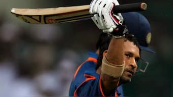 Sachin Tendulkar raises his bat to acknowledge the cheering crowd as he walks back to the pavilion after becoming the first man to score a double century in one-day internationals. Reuters file image