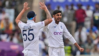 England off-spinner Shoaib Bashir celebrates with skipper Ben Stokes after dismissing India batter Rajat Patidar. AP