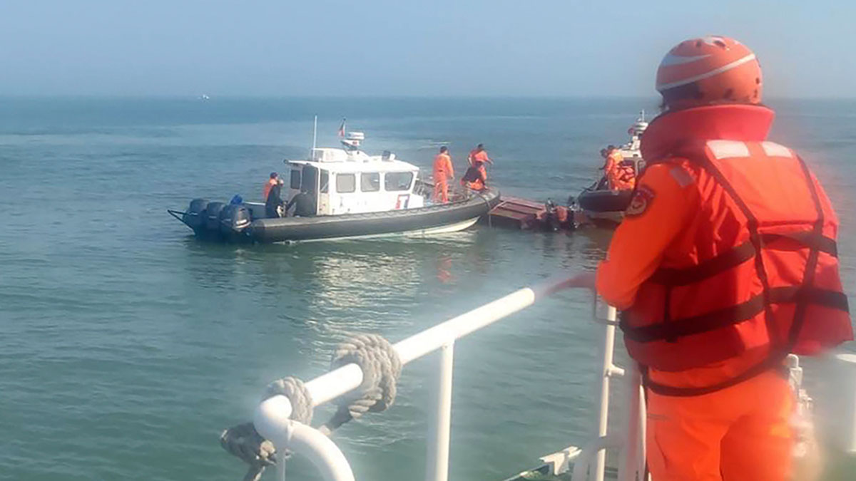 (File) In this handout photograph provided by Taiwan Coast Guard Administration, Taiwanese coast guards inspect a vessel that capsized during a chase off the coast of Kinmen archipelago in Taiwan, on 14 February, 2024. The unnamed vessel had been sailing about one nautical mile off the coast of an islet of Kinmen island and was trespassing, said Taiwan’s Coast Guard Administration. AP (File) In this handout photograph provided by Taiwan Coast Guard Administration, Taiwanese coast guards inspect a vessel that capsized during a chase off the coast of Kinmen archipelago in Taiwan, on 14 February, 2024. The unnamed vessel had been sailing about one nautical mile off the coast of an islet of Kinmen island and was trespassing, said Taiwan’s Coast Guard Administration. AP
