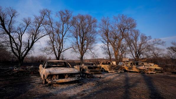 Wildfire grows into one of largest in Texas history as flames menace multiple small towns