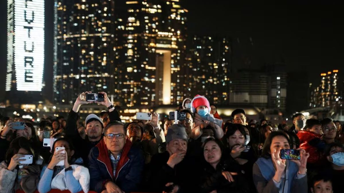 People watch the fireworks show over the Victoria Harbour on the second day of the Lunar New Year of the Dragon, in Hong Kong, China February 11, 2024. REUTERS People watch the fireworks show over the Victoria Harbour on the second day of the Lunar New Year of the Dragon, in Hong Kong, China February 11, 2024. REUTERS
