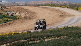 FILE PHOTO: A military vehicle maneuvres near the Israel-Gaza border. Reuters