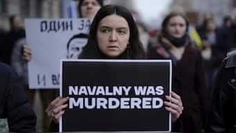 People attend a protest march near the Russian emabssy in Berlin to commemorate Russian opposition leader Alexei Navalny. AP