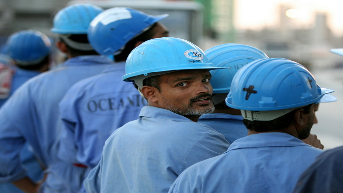 Indian workers line up to board a bus after a day's work in Dubai, 18 November 2005. Reuters File Photo Indian workers line up to board a bus after a day's work in Dubai, 18 November 2005. Reuters File Photo