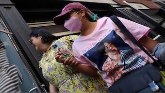 Fans of the South Korean boy band BTS rush to enter a pop-up shop selling BTS merchandise, New York, US, June 10, 2022. REUTERS/Mike Segar