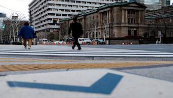 People walk in front of the Bank of Japan building in Tokyo. FILE PHOTO/  REUTERS
