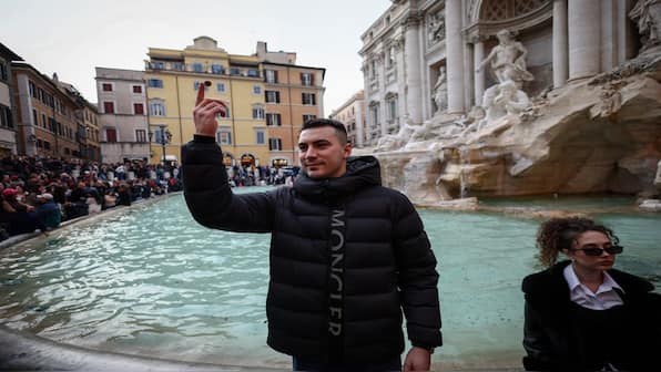 What happens to coins thrown into Rome's Trevi Fountain?