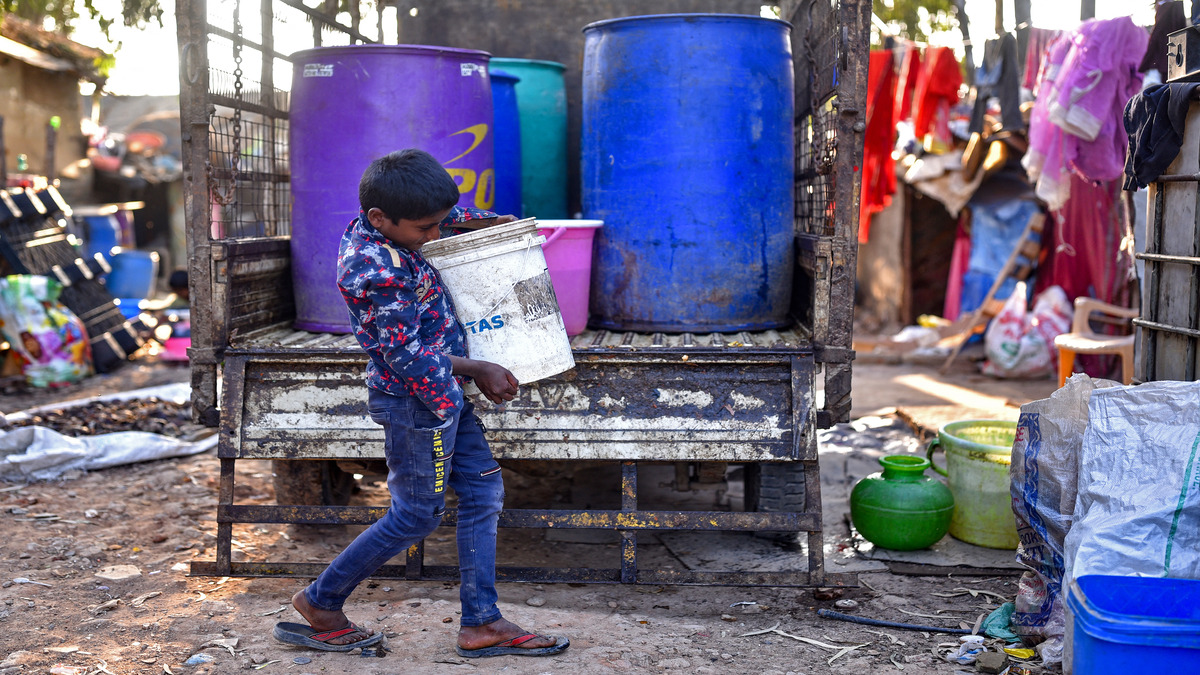A boy unloading cans of water collected from the restored Bingipura lake in Bengaluru on 29 January 2024. AFP File Photo A boy unloading cans of water collected from the restored Bingipura lake in Bengaluru on 29 January 2024. AFP File Photo