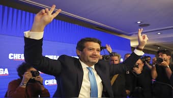 Andre Ventura, leader of populist right wing party Chega, gestures to supporters before addressing them following the announcement of results for Portugal's general election in Lisbon, 11 March 2024. AP
