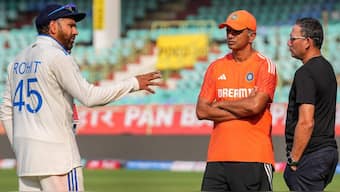 Rohit Sharma, Rahul Dravid and Ajit Garkar in conversation. PTI