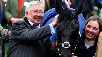 Alex Ferguson celebrates after winning the 14:10 Pertemps Handicap Hurdle with Monmiral ridden by Harry Cobden. Reuters