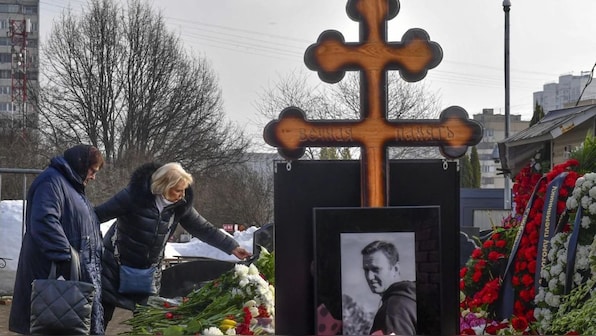 Navalny’s mother brings flowers to his grave a day after thousands attended his funeral in Moscow