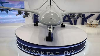 (File) Bayraktar TB2 drone stands near the logo of Baykar Turkish defence company inside a hall of 30th international Defence Industry Exhibition in Kielce, Poland on 5 September, 2022. Reuters