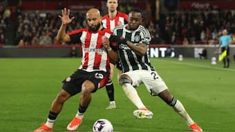 Brentford's Bryan Mbeumo (L) vies for the ball with Manchester United's Aaron Wan-Bissaka during a English Premier League game. AP