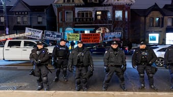 Police stand guard outside an event where Italian Prime Minister Giorgia Meloni was supposed to meet with Canada's Prime Minister Justin Trudeau but it was cancelled due to protestors outside, at the Art Gallery of Ontario in Toronto, Ontario, Canada. Reuters