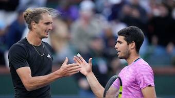 Carlos Alcaraz, of Spain, right, shakes hands with Alexander Zverev, of Germany, after a quarterfinal match, won by Alcaraz, at the BNP Paribas Open tennis tournament. AP