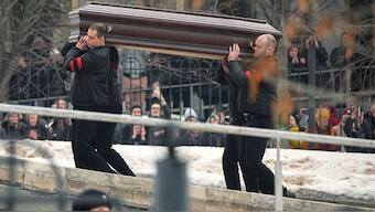 People watch as workers carry the coffin of Russian opposition leader Alexei Navalny to the Church of the Icon of the Mother of God Soothe My Sorrows, in Moscow, Russia, Friday, March 1, 2024. - AP