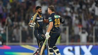 Vijay Shankar and David Miller celebrate after the latter hit the winning six to help Gujarat Titans defeat Sunrisers Hyderabad by seven wickets. AP
