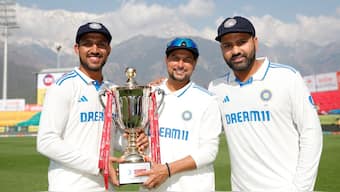 Dhruv Jurel, Kuldeep Yadav and skipper Rohit Sharma pose with the Anthony D'Mello Trophy following India's 4-1 series win over England. Sportzpics