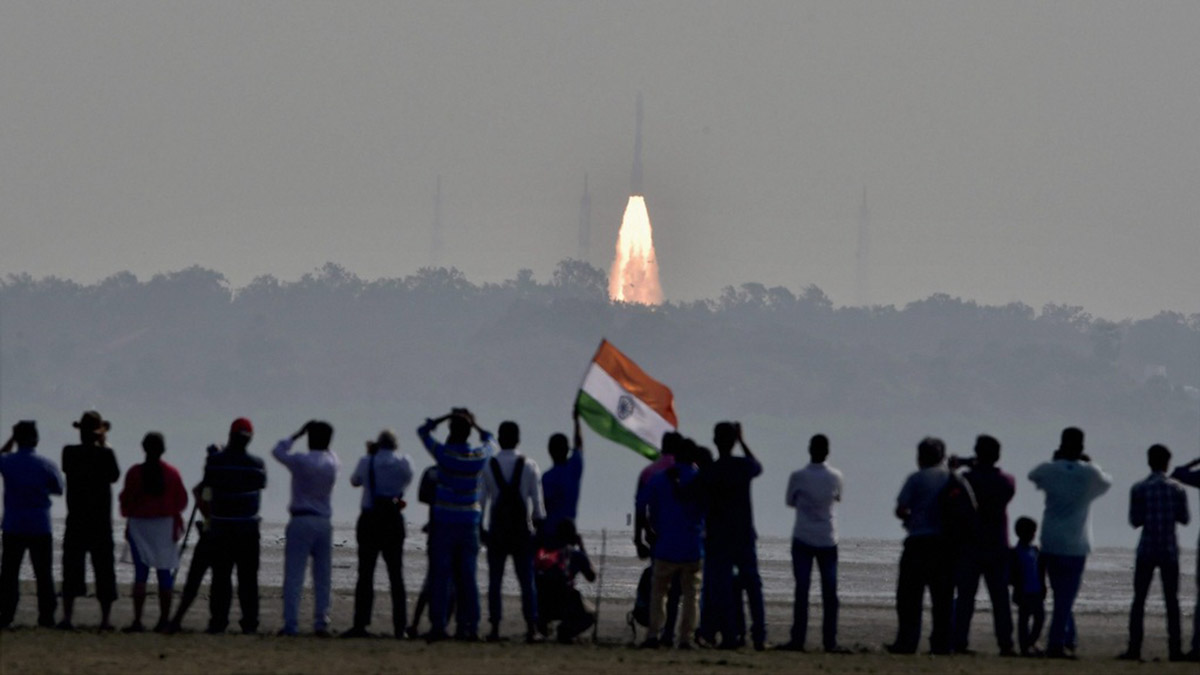 (File) People watch as as a rocket from  Space agency Indian Space Research Organisation takes off  successfully to launch a record 104 satellites, including India’s earth observation satellite on-board PSLV-C37 from the spaceport of Sriharikota. PTI (File) People watch as as a rocket from  Space agency Indian Space Research Organisation takes off  successfully to launch a record 104 satellites, including India’s earth observation satellite on-board PSLV-C37 from the spaceport of Sriharikota. PTI