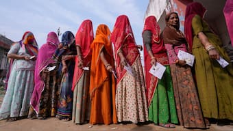 (File) Women stand in a queue to cast their votes in Chachiyawas village, near Ajmer,  on 25 November, 2023. AP