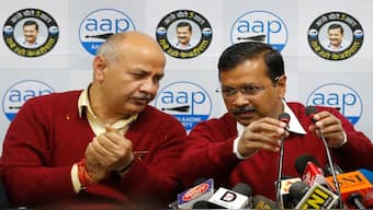 Aam Aadmi Party chief Arvind Kejriwal, right, talks with party leader Manish Sisodia in New Delhi, India, 4 February 2020. PTI