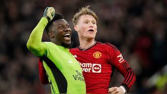 Manchester United's Scott McTominay (R) and Andre Onana celebrate at full time after winning FA Cup quarterfinal against Liverpool. AP