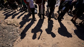 Migrants wait to be processed by the U.S. Customs and Border Patrol after they crossed the Rio Grande and entered the U.S. from Mexico, in Eagle Pass, Texas. AP File