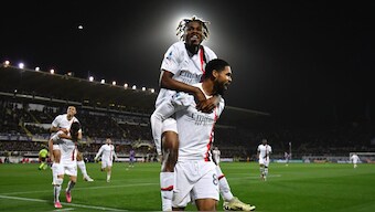 AC Milan's Samuel Chukwueze climbs on Ruben Loftus-Cheek to celebrate a goal against Fiorentina in Serie A. AP