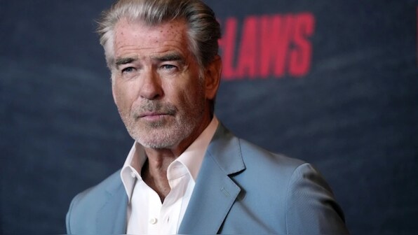 Pierce Brosnan pleads guilty to walking off trail at Yellowstone hot springs, must pay $1,500