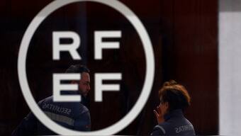 Security guards stand outside the Spanish football federation headquarters. Reuters