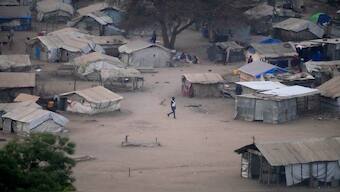 People stand by their houses in Juba, South Sudan. AP File