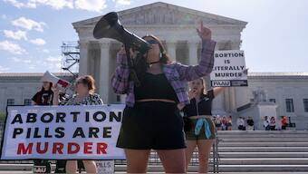 Anti-abortion activists hold signs calling for the Supreme Court justices to "affirm the decision of Federal District Court Judge Matthew Kacsmaryk who suspended the Food and Drug Administration's approval of Mifepristone," in front of the US Supreme Court in Washington, US. Reuters File