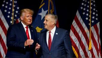 Former US President Donald Trump with his choice to lead the Republican National Committee, Michael Whatley. AFP
