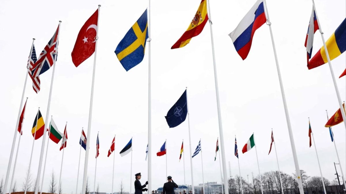 Officials hoisting Sweden's flag along with that of other NATO nations on Monday, AFP. Officials hoisting Sweden's flag along with that of other NATO nations on Monday, AFP.