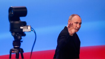 Russian presidential candidate and incumbent President Vladimir Putin gestures as he leaves following his speech after polling stations closed, in Moscow, Russia, March 18, 2024. Reuters